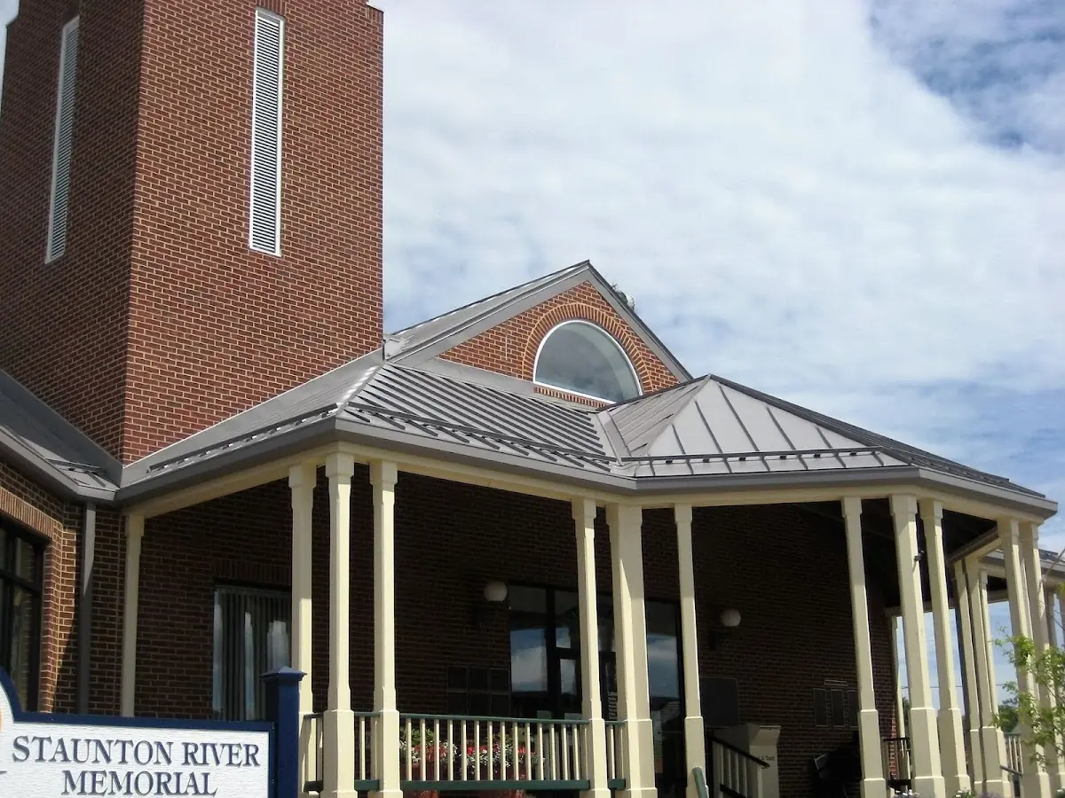 Skilled roofing craftsmen working on a residential roof in Hampton Beach